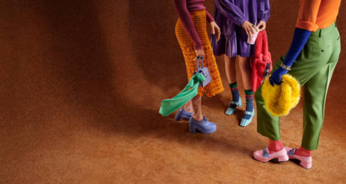 Group of people showing brightly colored shoes