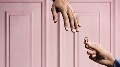 Image showing pink background and hands giving ring